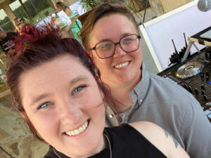 Sarah and Stephanie, bringers of the party, behind the board dj'ing a summer Texas Wedding at El Cerrito Lodge in Diana, TX.